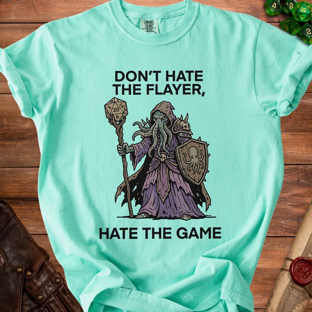 Mint t-shirt with "Don't Hate The Flayer, Hate The Game" and Cthulhu-like wizard graphic.