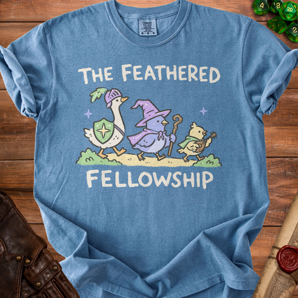 Blue t-shirt with "The Feathered Fellowship" and cartoon animals in medieval attire.