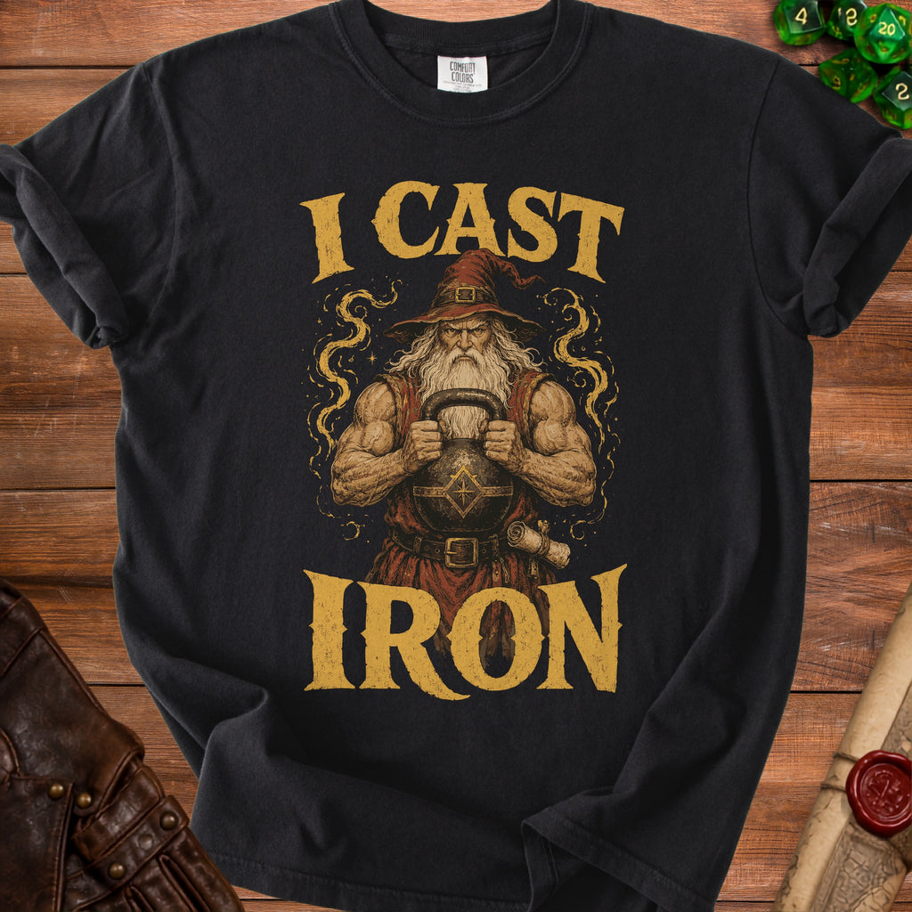 Black t-shirt with a muscular wizard holding a kettlebell and the text "I CAST IRON".
