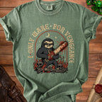 Green t-shirt with a sloth holding a bloody chainsaw and skulls, text reads "I ONLY WAKE FOR VENGEANCE".