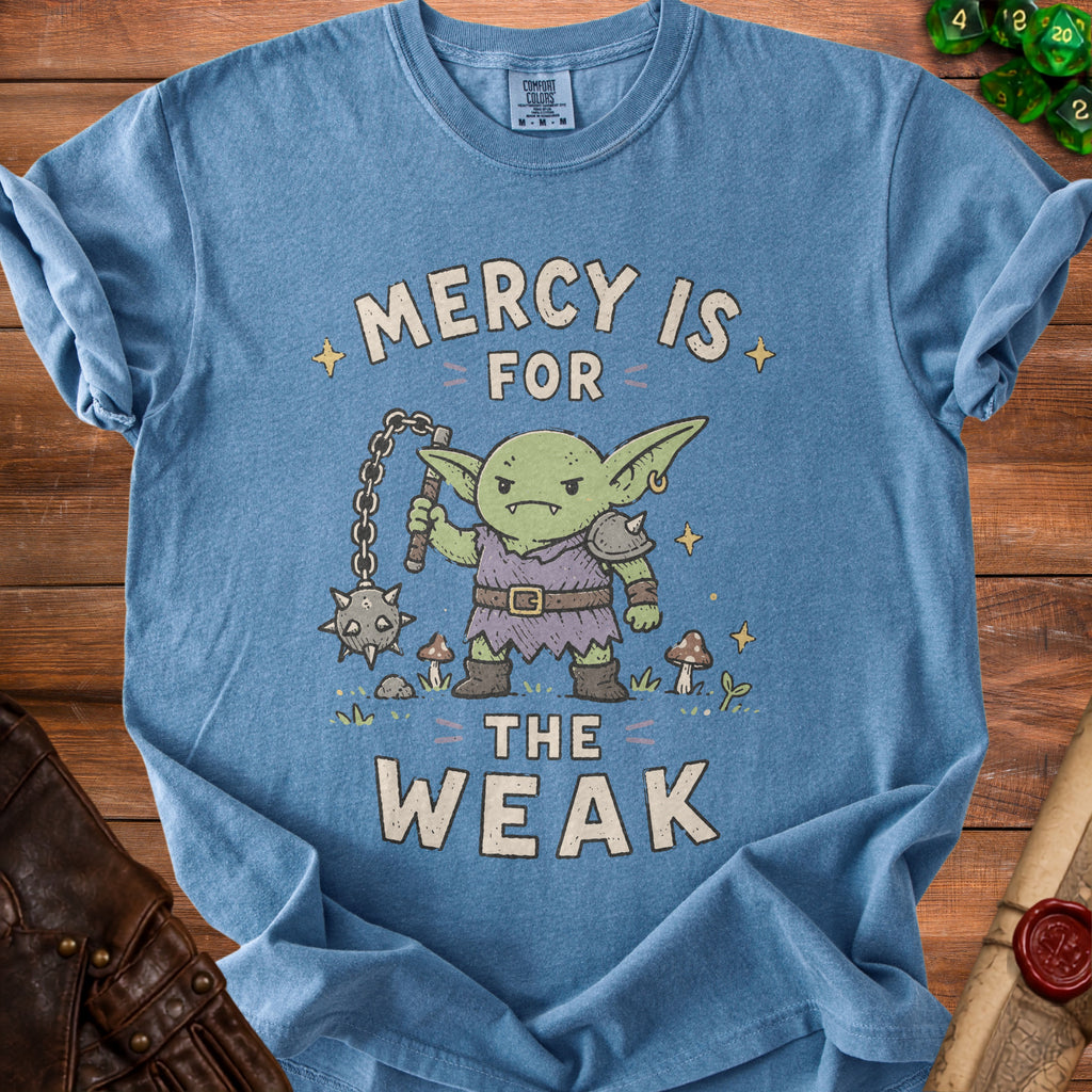 Blue t-shirt with a goblin holding a flail and the text "Mercy is for the weak."
