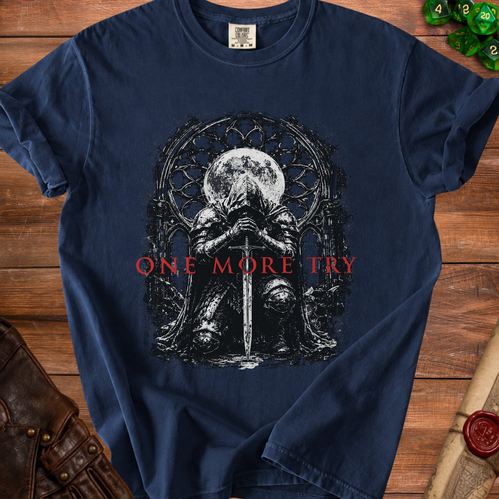 Dark t-shirt with knight, sword, moon, and "ONE MORE TRY" text.