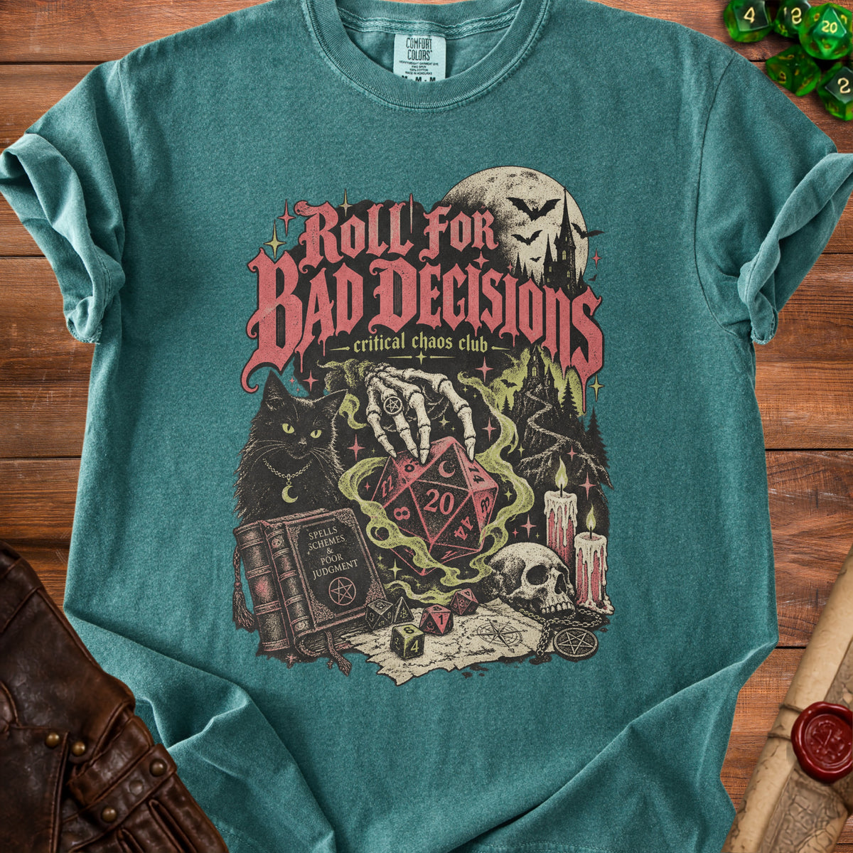 Teal t-shirt with "Roll For Bad Decisions" graphic, skeleton hand, dice, and spooky elements.