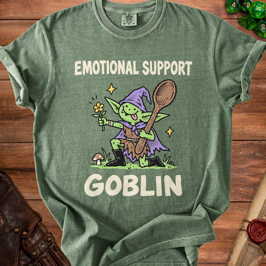 Green t-shirt with a cartoon goblin holding a flower and a wooden spoon, text "Emotional Support Goblin".