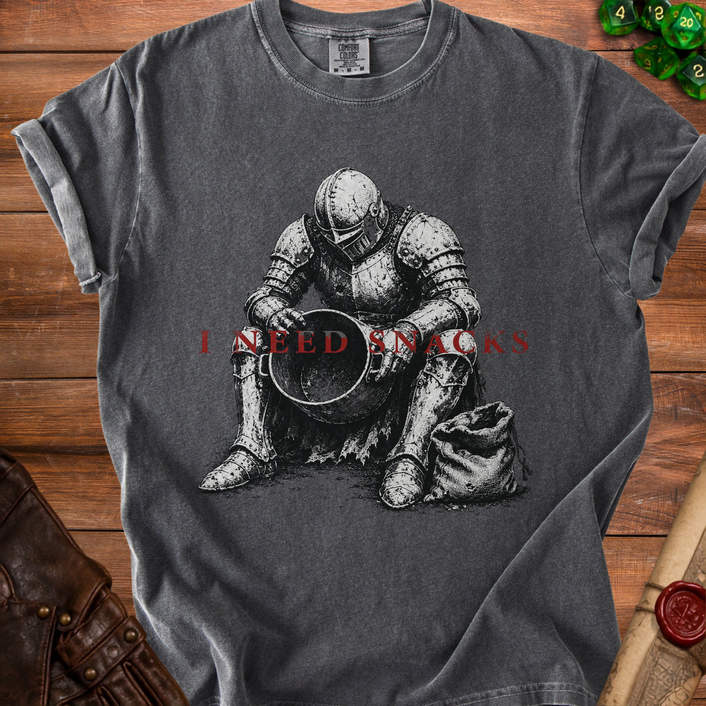 T-shirt with knight illustration and "I NEED SNACKS" text.