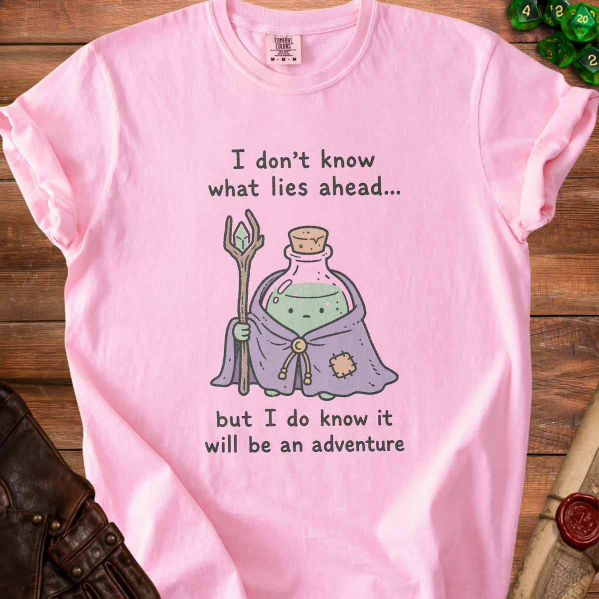 Pink t-shirt with text "I don't know what lies ahead... but I do know it will be an adventure".