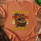 Terracotta t-shirt with "Keep an Open Mind" text and monster chest graphic.