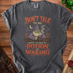 Dark gray t-shirt with a wizard graphic and text "Don't talk to me until I've had my potion of waking."