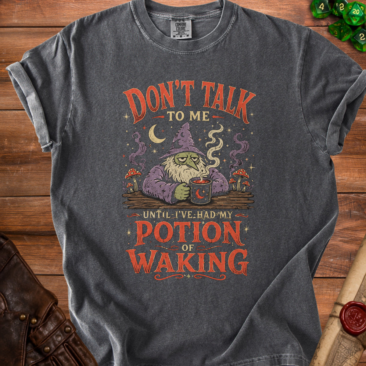 Dark gray t-shirt with a wizard graphic and text "Don't talk to me until I've had my potion of waking."