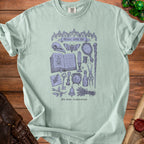 Light blue t-shirt with "Minor curse kit" and occult illustrations.