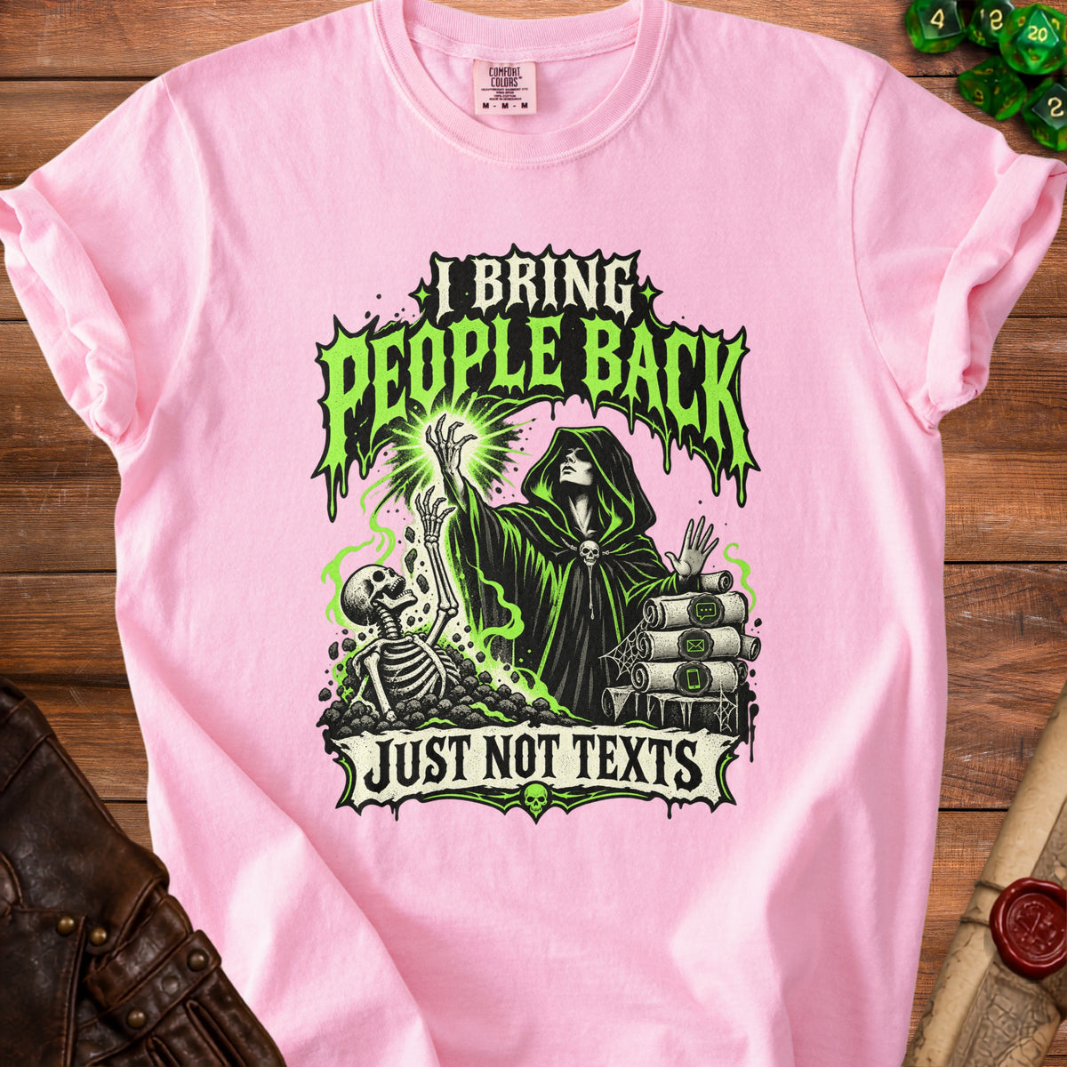 Pink t-shirt with green graphic: "I bring people back just not texts."