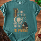 Teal t-shirt with "I Have Seen The Omens And They Are Not My Problem" text and raven graphic.