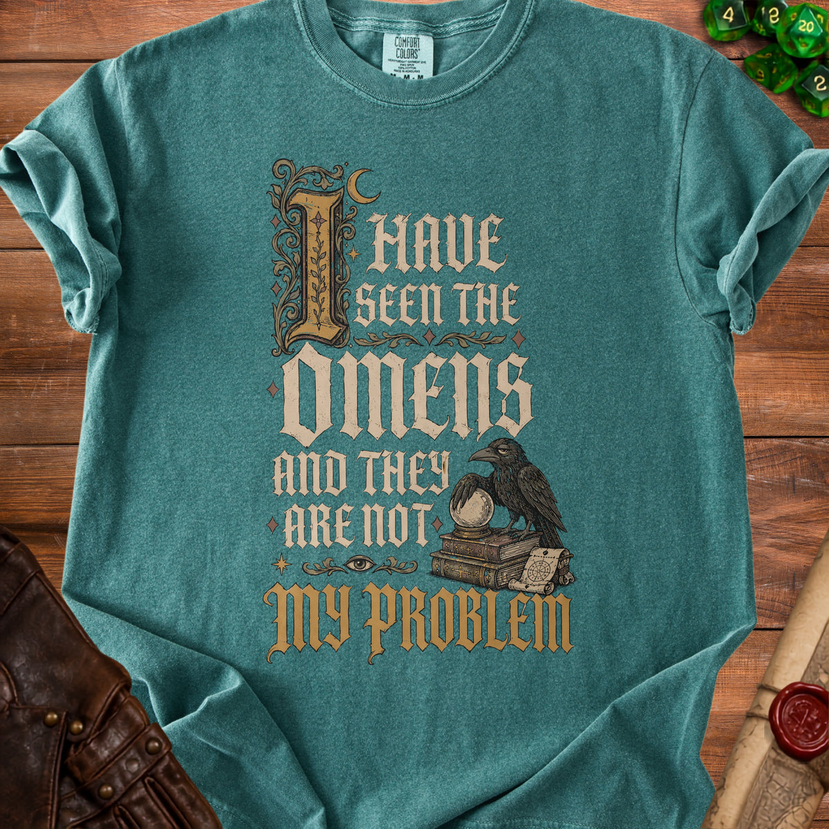 Teal t-shirt with "I Have Seen The Omens And They Are Not My Problem" text and raven graphic.