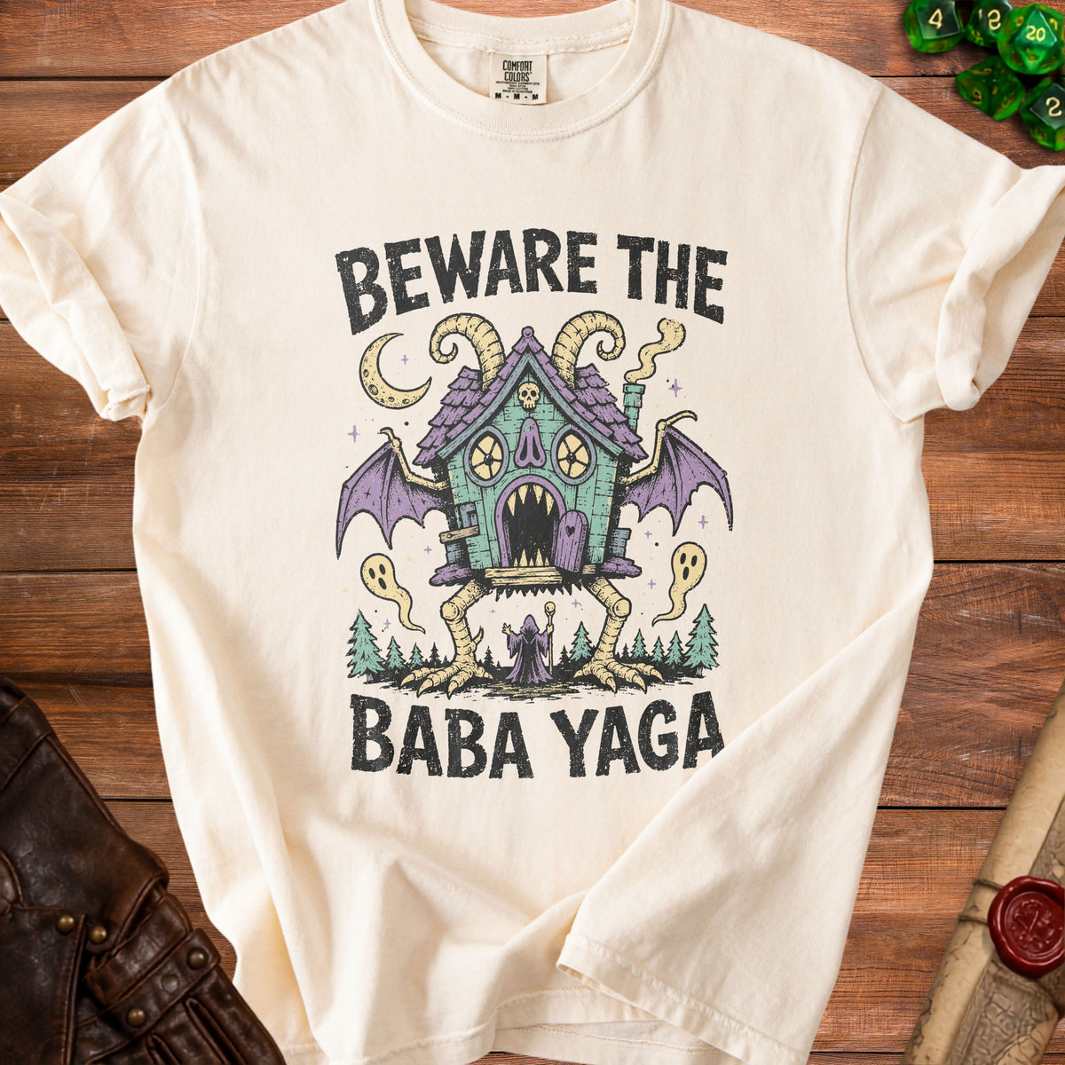 Cream t-shirt with "Beware The Baba Yaga" text and illustration.