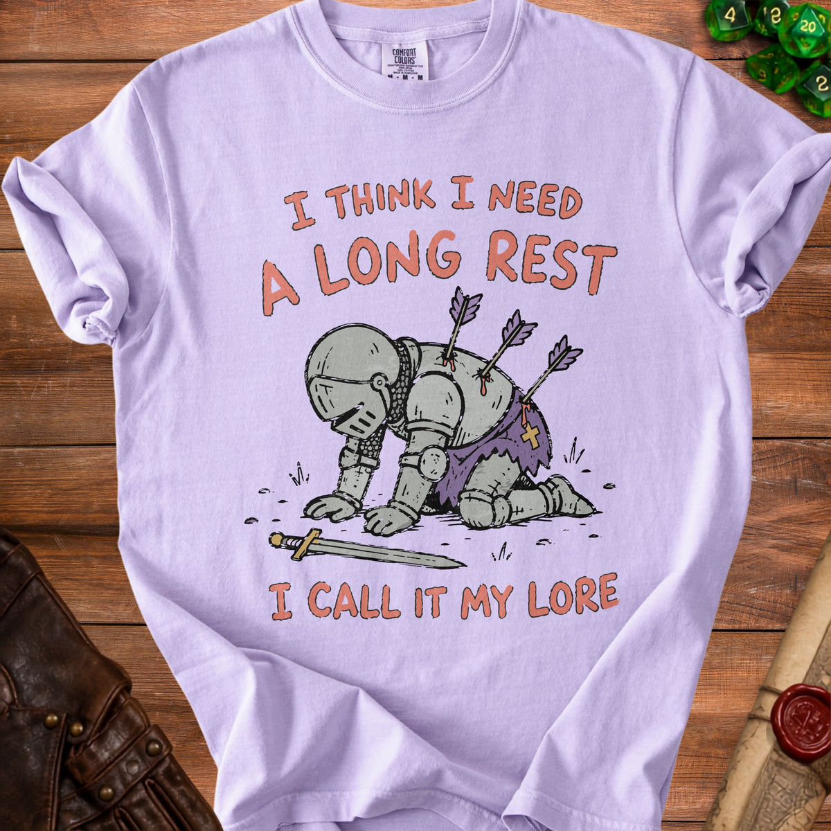 Lavender t-shirt with illustration of knight with arrows, text reads "I THINK I NEED A LONG REST I CALL IT MY LORE".