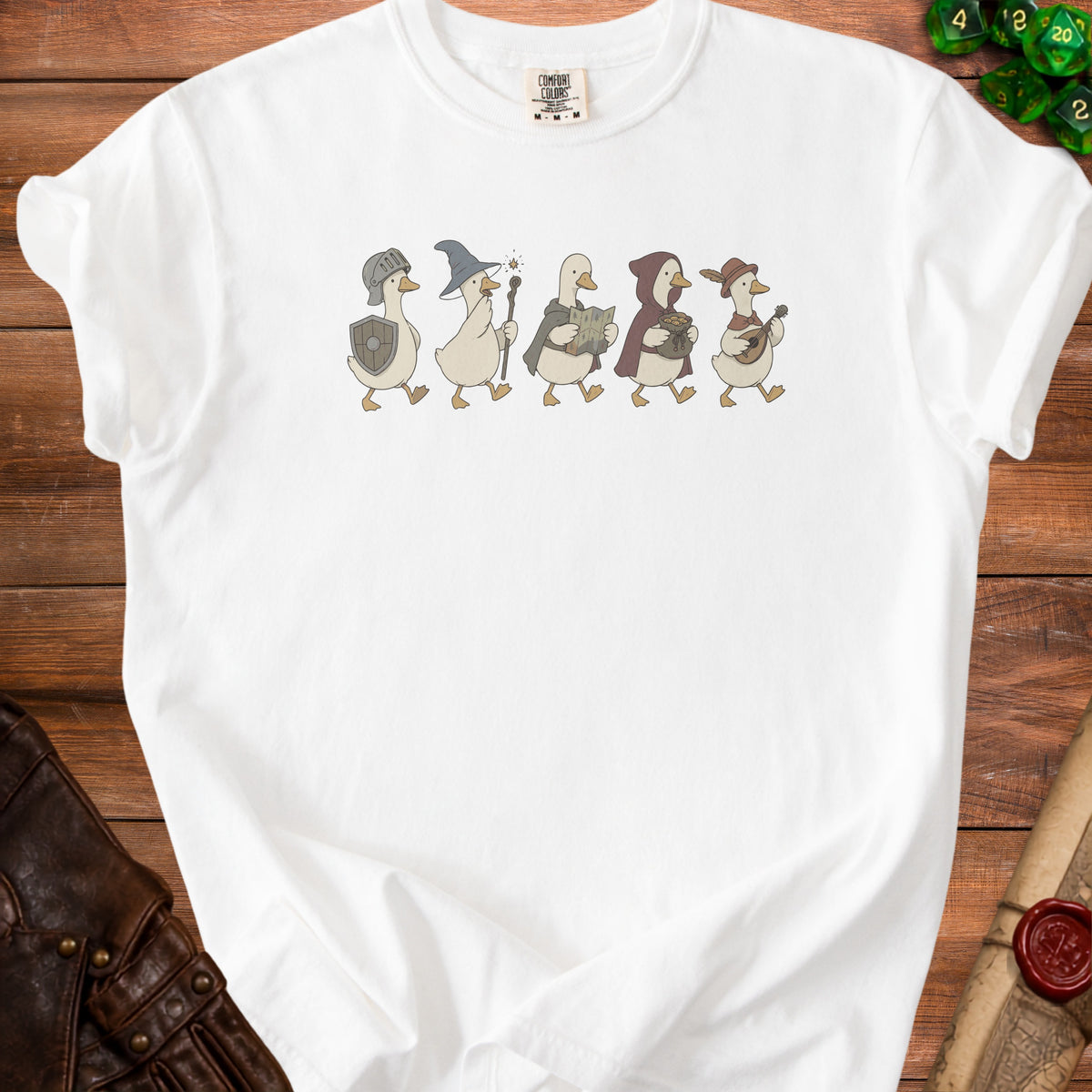 White t-shirt with five walking geese dressed as fantasy characters.