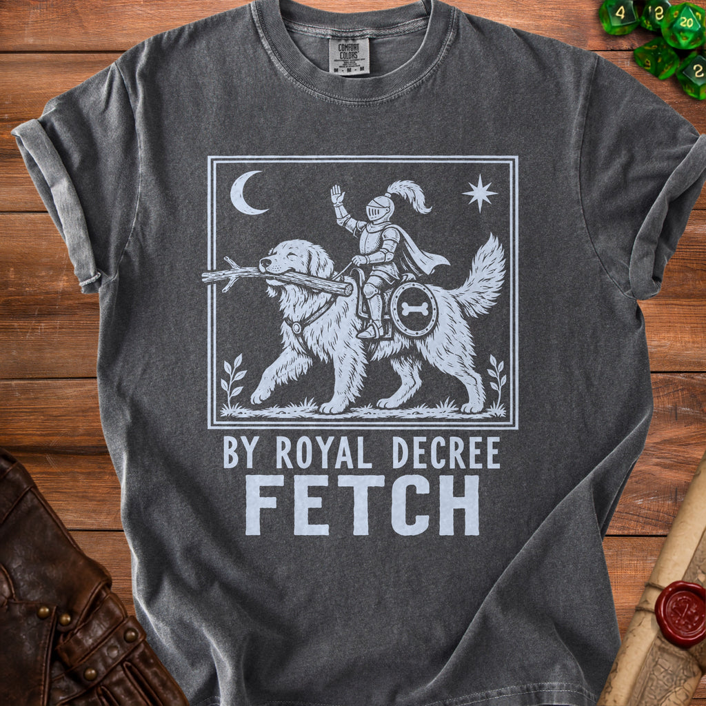 Dark grey t-shirt with white graphic of knight riding dog with stick and text "BY ROYAL DECREE FETCH"