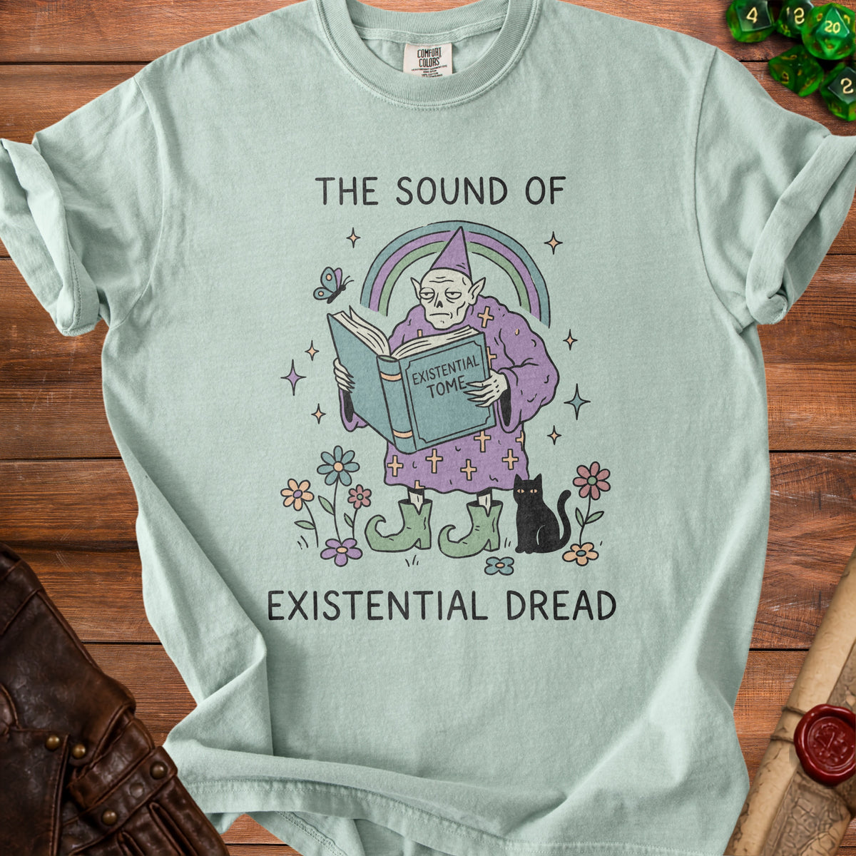Shirt with wizard reading "Existential Tome" and black cat, text "The Sound of Existential Dread".