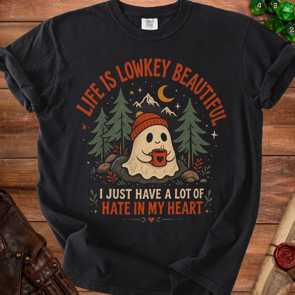T-shirt with ghost, coffee, trees, mountains, moon, and text "LIFE IS LOWKEY BEAUTIFUL".