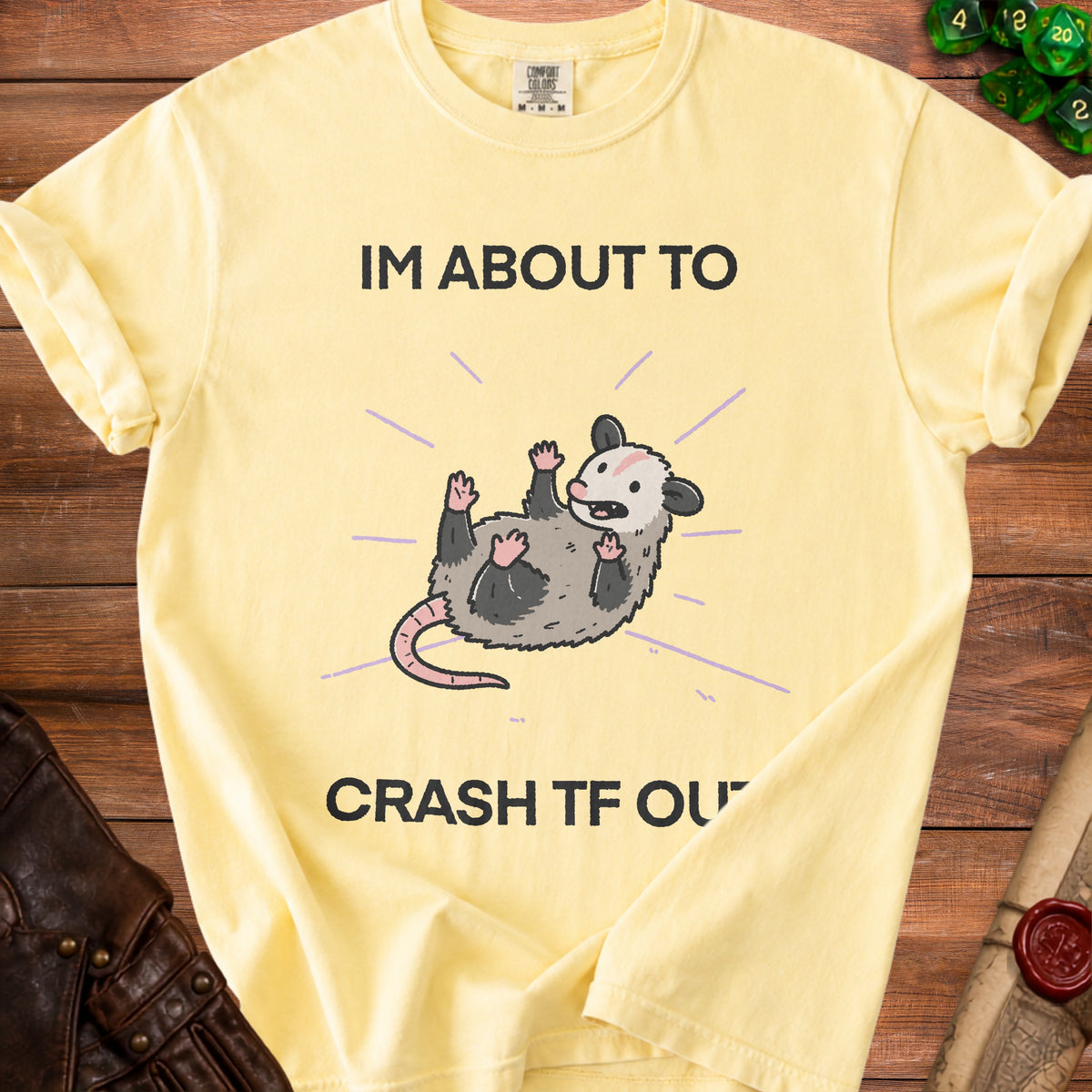 Yellow t-shirt with cartoon possum and text "IM ABOUT TO CRASH TF OU".
