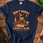 Frog wizard reads book titled "Plans" with text "Don't worry I have a plan".