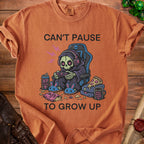 T-shirt with grim reaper gamer graphic and text "Can't Pause To Grow Up".