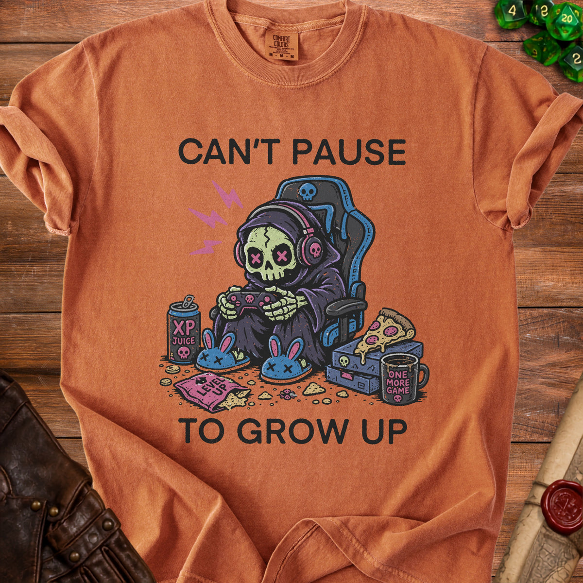 T-shirt with grim reaper gamer graphic and text "Can't Pause To Grow Up".