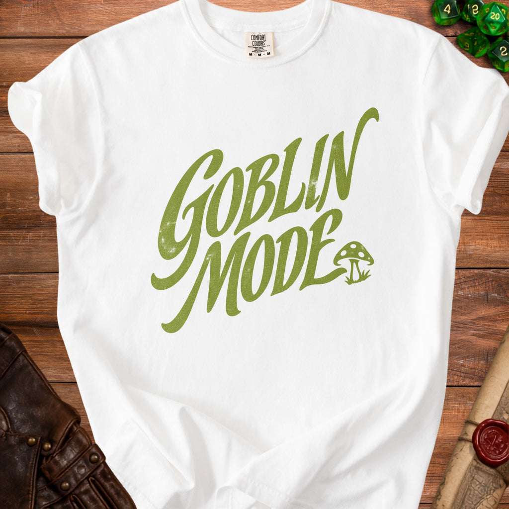 White t-shirt with green "Goblin Mode" text and mushroom graphic.