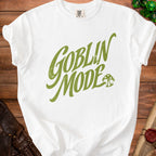 White t-shirt with green "Goblin Mode" text and mushroom graphic.