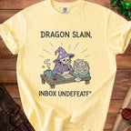 Yellow t-shirt with skeleton wizard and text "Dragon Slain, Inbox Undefeated".