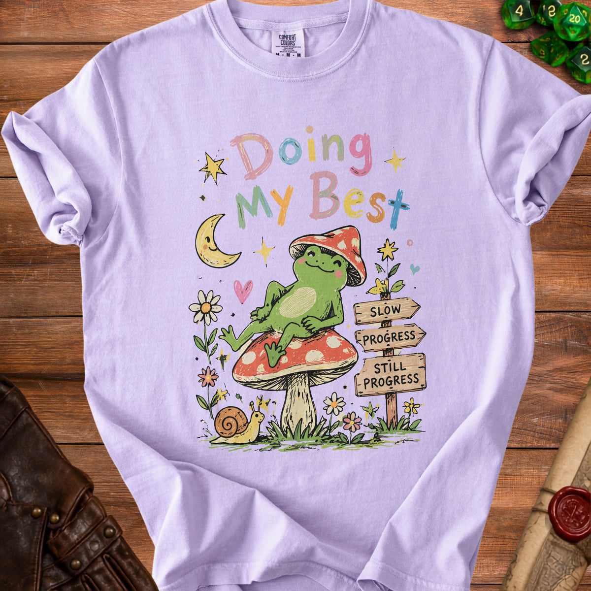 Lavender t-shirt with pastel text "Doing My Best" and a frog on a mushroom.