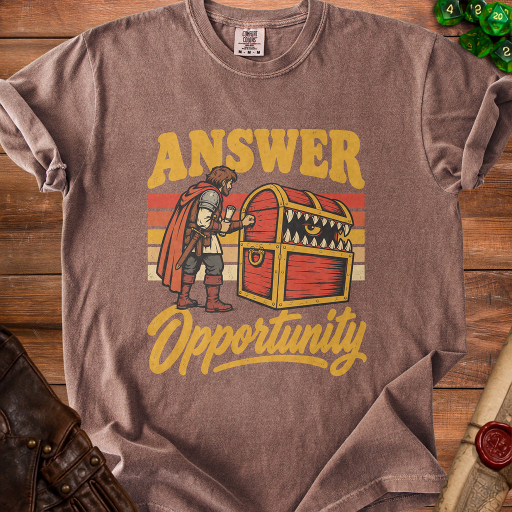 T-shirt graphic with text "ANSWER" and a monster treasure chest, "Opportunity".