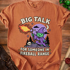 T-shirt with a cartoon witch casting a fireball, text "BIG TALK FOR SOMEONE IN FIREBALL RANGE".