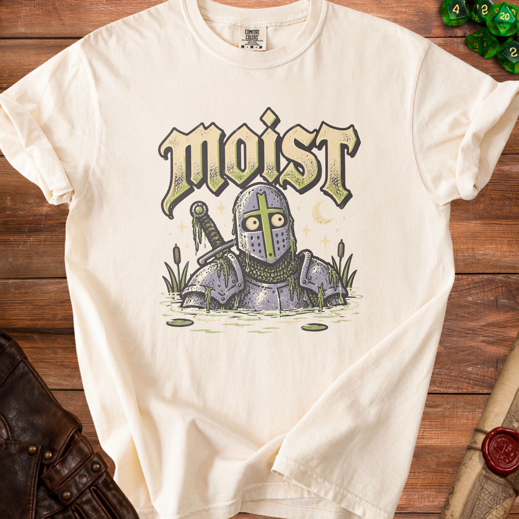 Cream t-shirt with a knight in armor standing in water with text "moist" above.