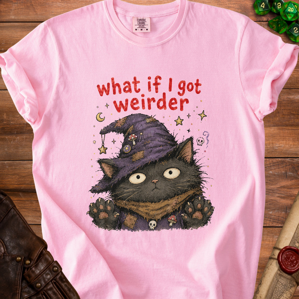 Pink t-shirt with black cat wearing a witch hat and the text "what if I got weirder".
