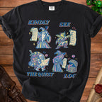 Black t-shirt featuring cartoon fantasy characters with text "Kindly See The Quest Log".