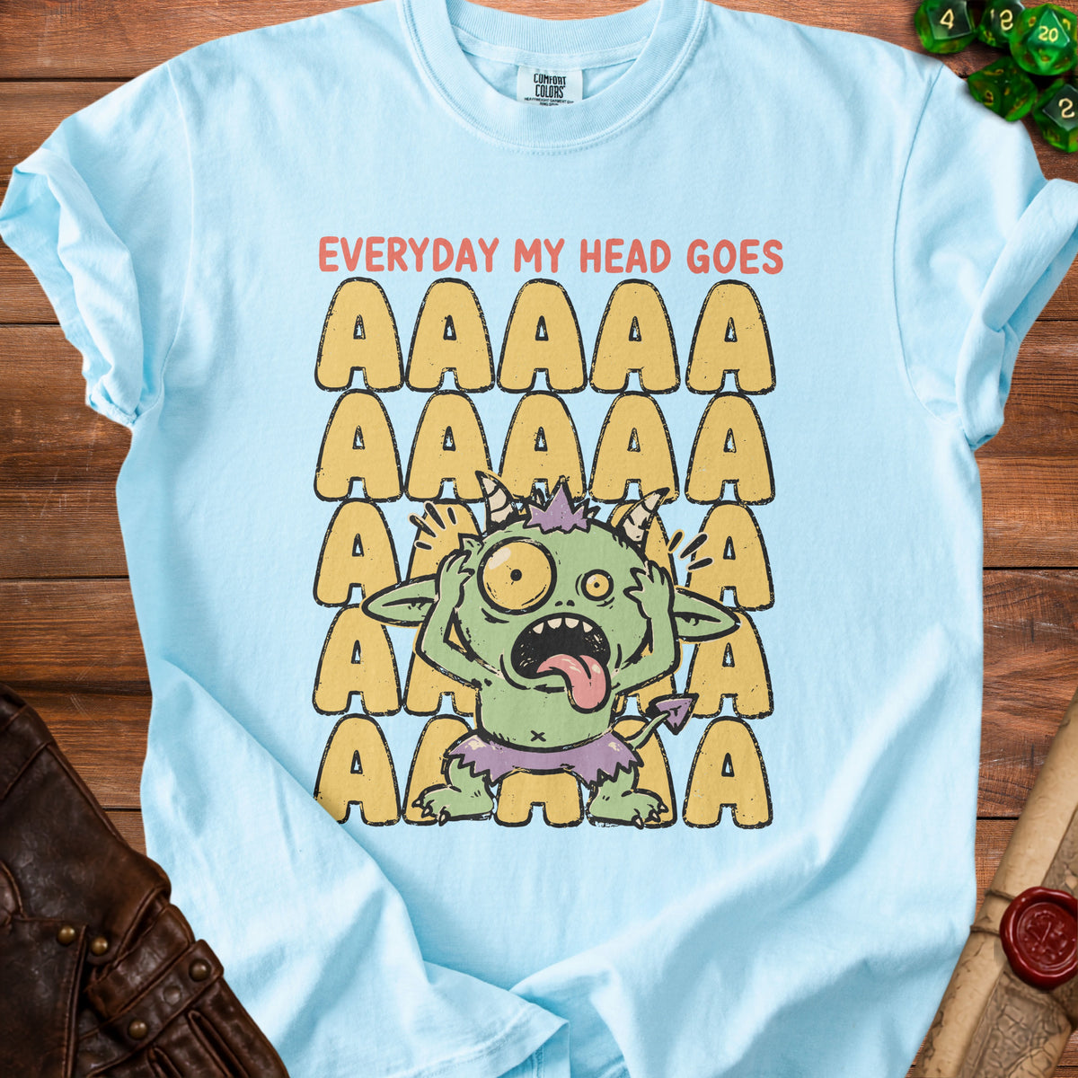Light blue t-shirt with a distressed graphic of a green monster and "EVERYDAY MY HEAD GOES AAAAA".