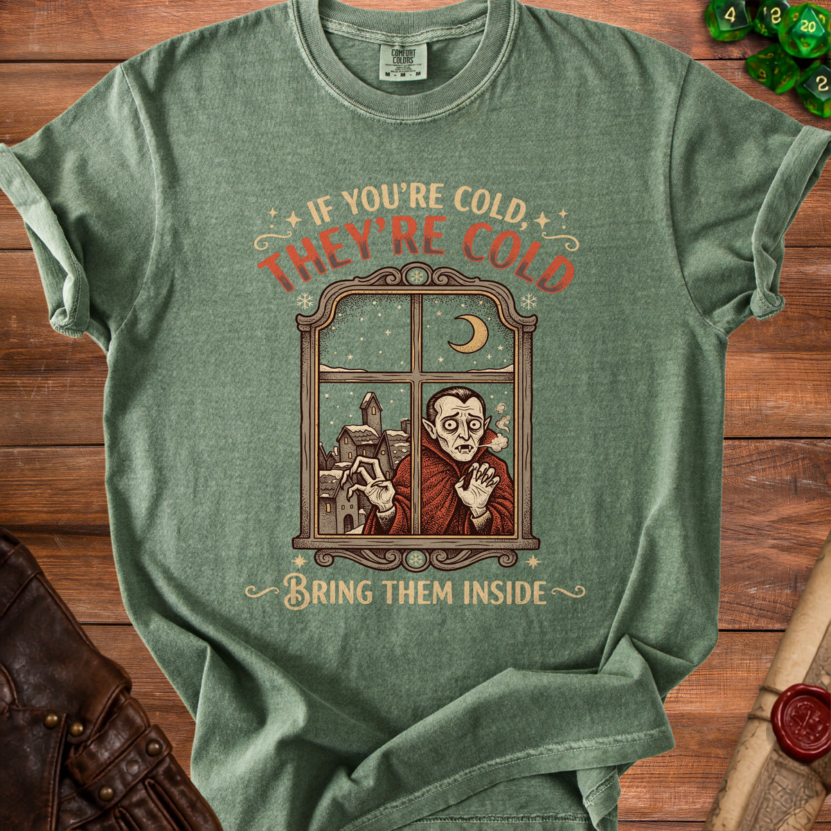 Green t-shirt with vampire at window, "If you're cold, they're cold. Bring them inside."