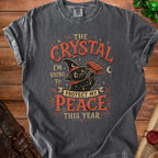 Black cat in witch hat holds brick; text says "The crystal I'm using to protect my peace this year."