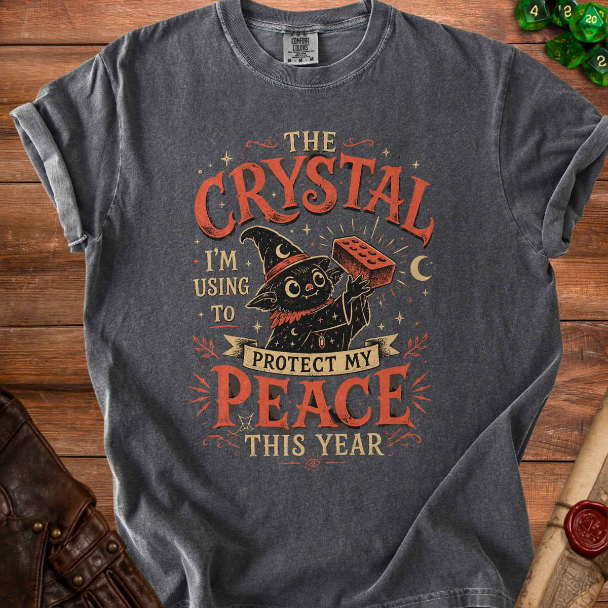 Black cat in witch hat holds brick; text says "The crystal I'm using to protect my peace this year."