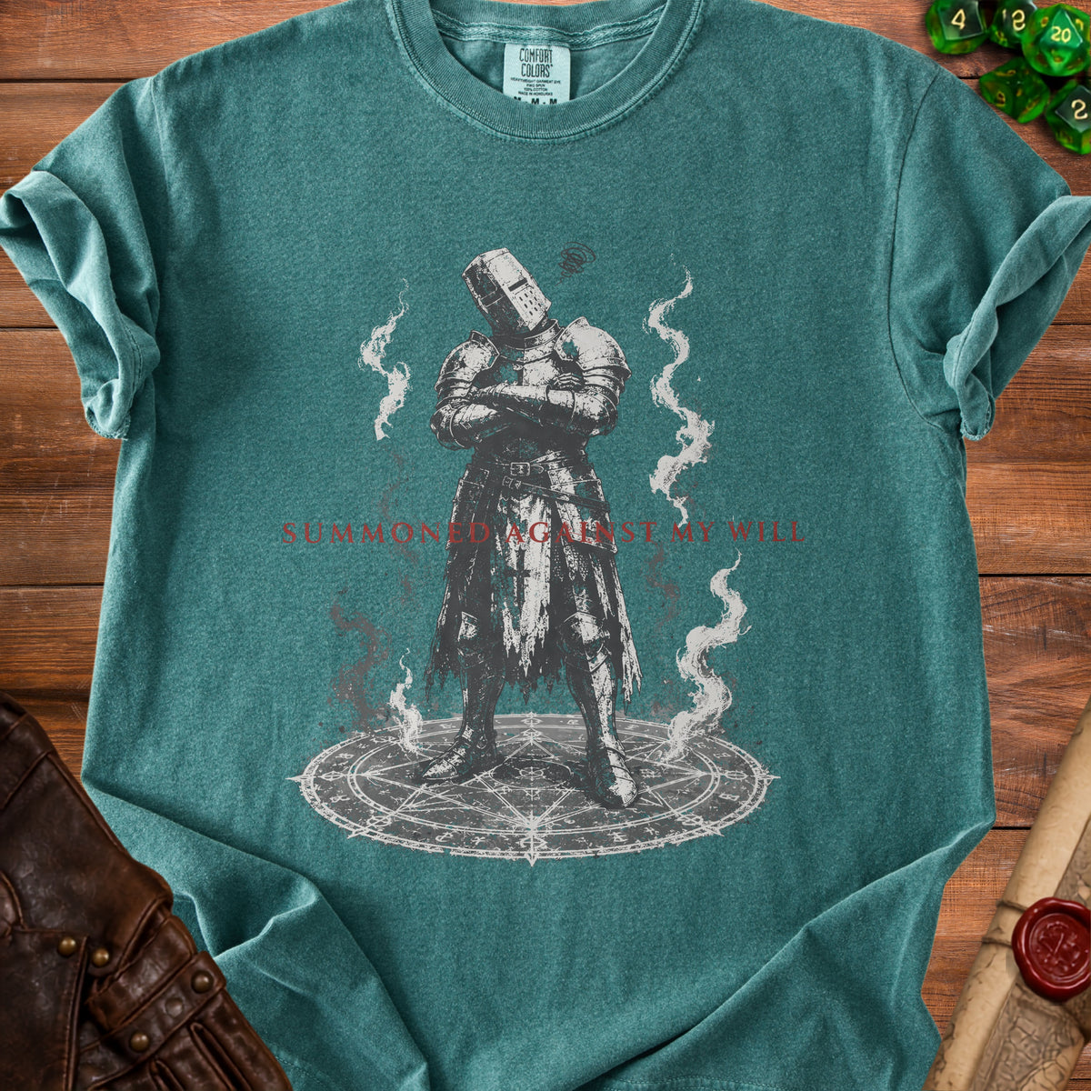 T-shirt graphic of knight on pentagram with text "SUMMONED AGAINST MY WILL".