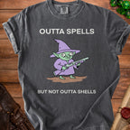 Dark grey t-shirt with a goblin in a witch hat holding a shotgun and text "Outta Spells But Not Outta Shells."