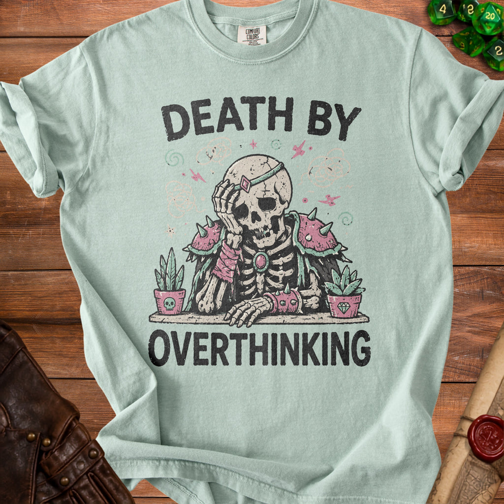 Light blue t-shirt with a skeleton graphic and text "DEATH BY OVERTHINKING."