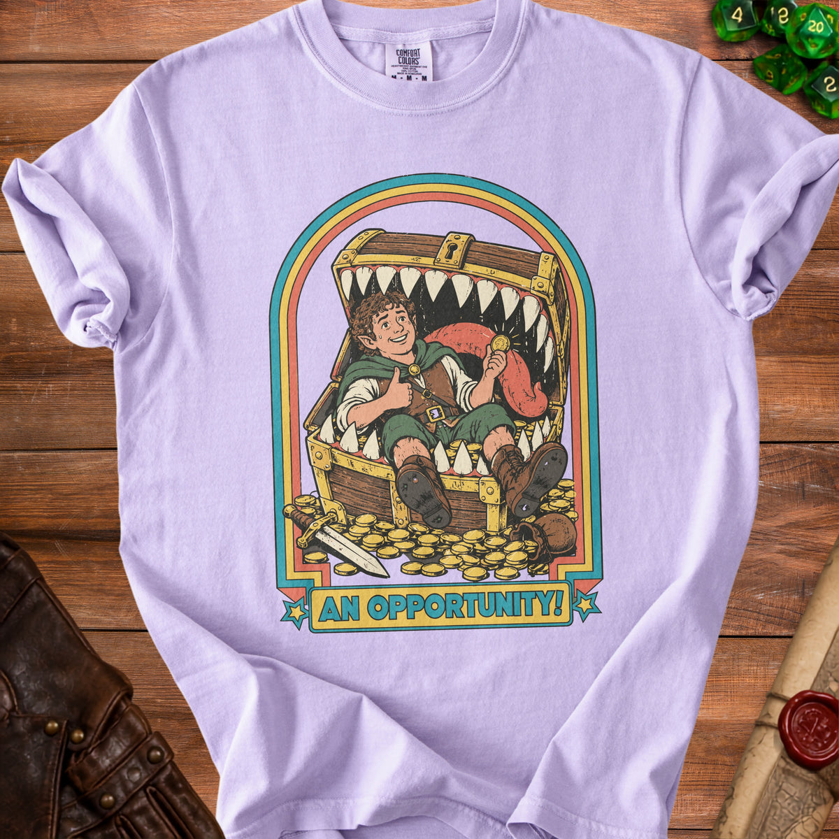 Lilac t-shirt with graphic of a hobbit-like character giving thumbs up inside a treasure chest filled with gold, text "AN OPPORTUNITY!".