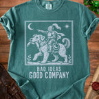 Green t-shirt with white graphic of knight riding a dog, text "BAD IDEAS GOOD COMPANY".