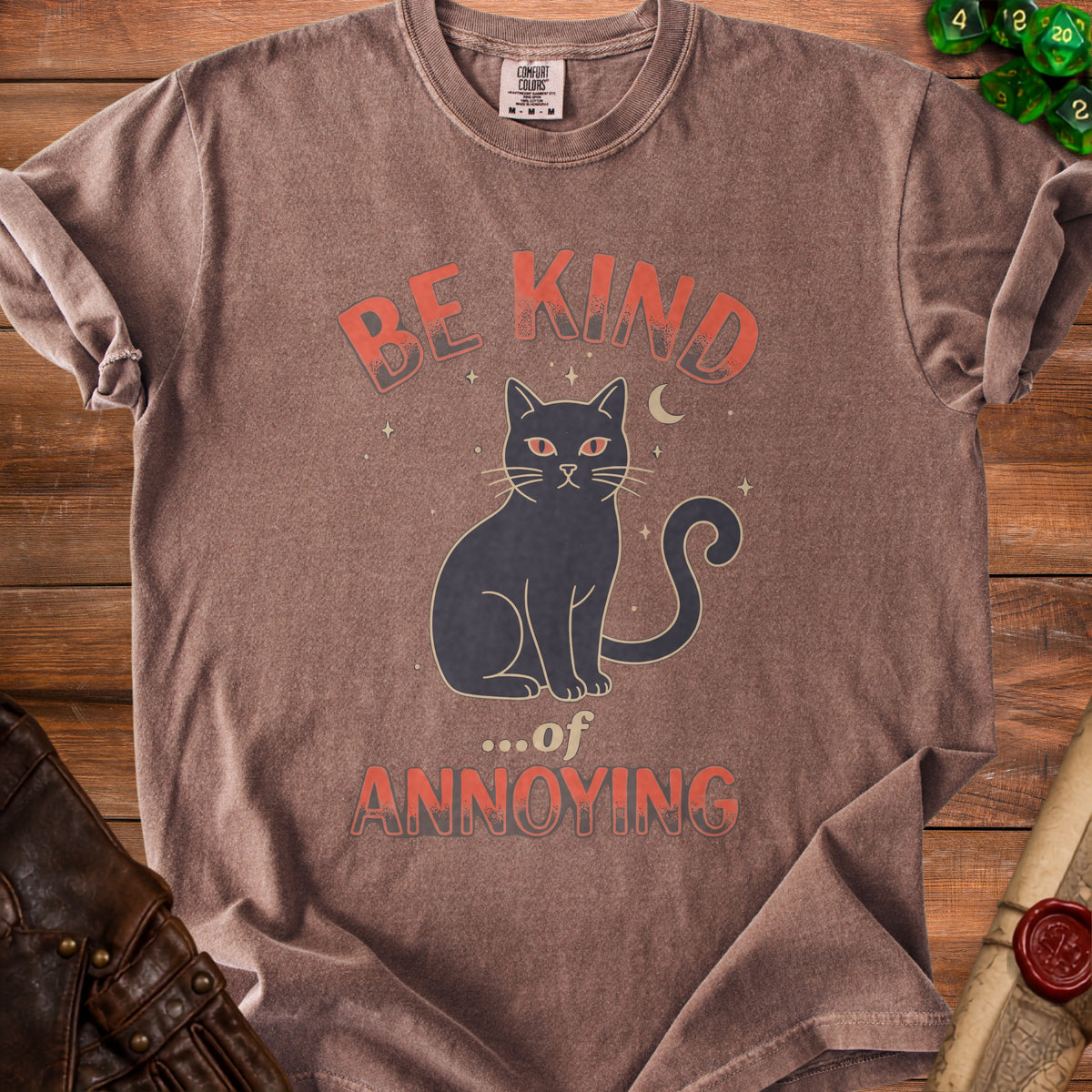 Brown t-shirt with graphic of black cat and text "Be Kind ...of Annoying".