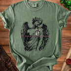 Green t-shirt with angel graphic and text "FINE. FLOURISHING. FALLING APART".