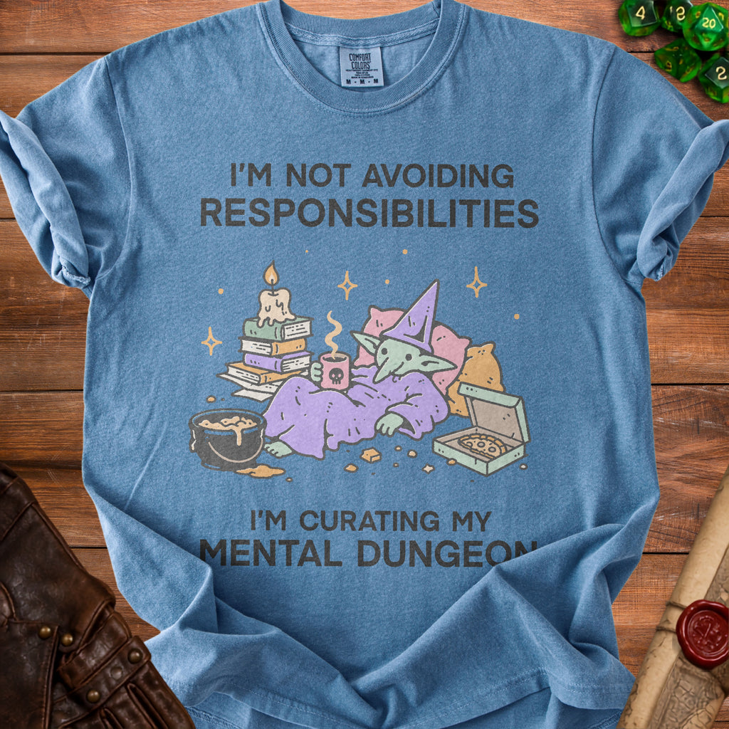 Blue t-shirt with graphic of a relaxed goblin, pizza, and text.