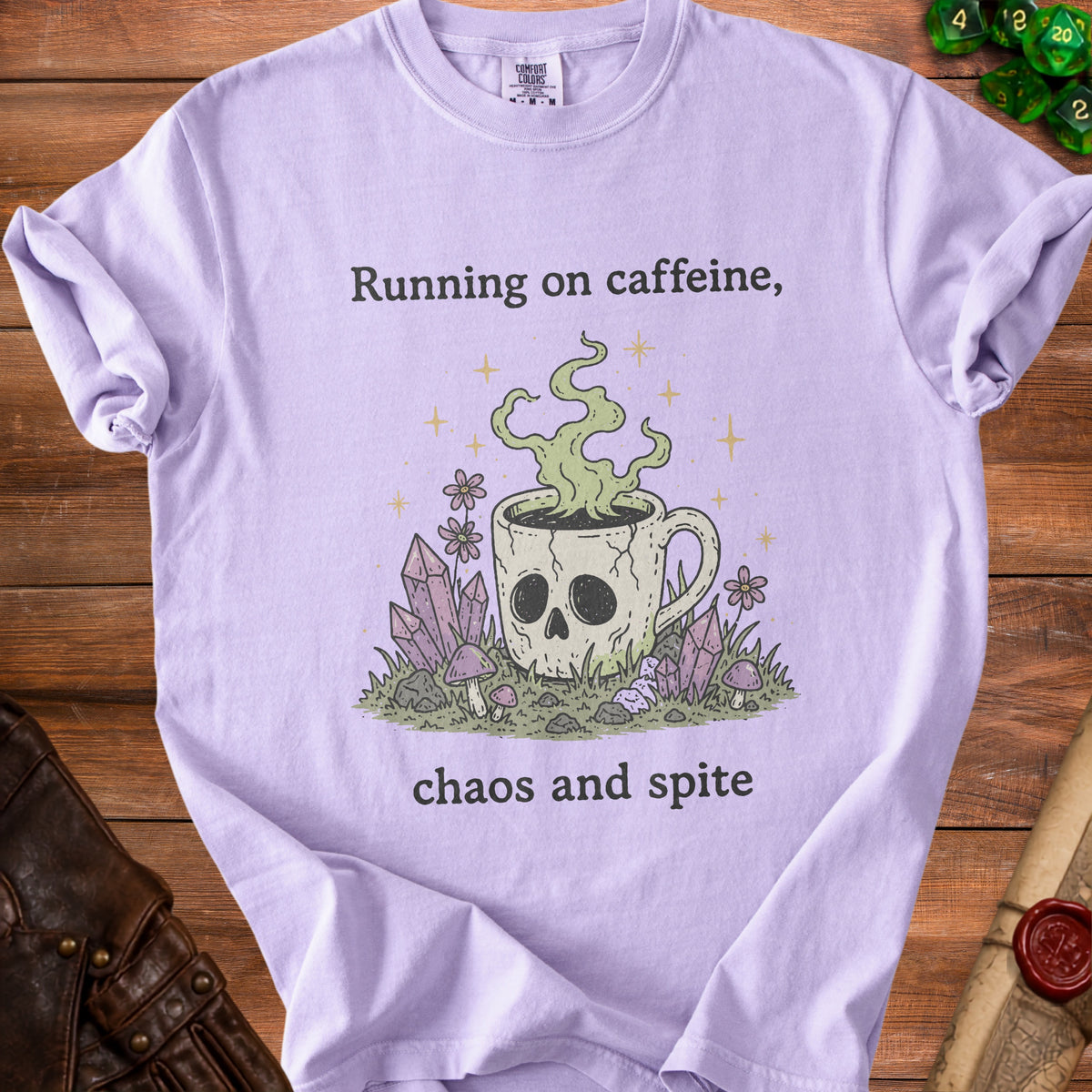Light purple t-shirt with skull coffee cup graphic and text "Running on caffeine, chaos and spite".