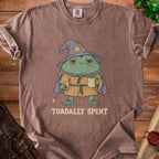 Brown t-shirt with a wizard frog graphic and "Toadally Spent" text.